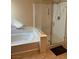 Bright bathroom features a glass shower and soaking tub at 3609 Citrus Heights Ave, North Las Vegas, NV 89081