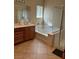 Bright bathroom features a soaking tub, glass-enclosed shower, and a vanity with ample storage space at 3609 Citrus Heights Ave, North Las Vegas, NV 89081