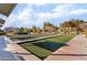 A pristine bocce ball court surrounded by landscaped grounds and seating areas at 3609 Citrus Heights Ave, North Las Vegas, NV 89081