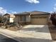 Charming single-story home with a neutral color palette, desert landscaping, and a two-car garage at 3609 Citrus Heights Ave, North Las Vegas, NV 89081