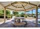 Charming gazebo with stone table seating nestled in a well-maintained community area at 3609 Citrus Heights Ave, North Las Vegas, NV 89081