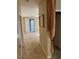 Spacious hallway leads to living areas, filled with natural light and plush carpet at 3609 Citrus Heights Ave, North Las Vegas, NV 89081