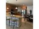 Well-lit kitchen features stainless steel appliances, granite countertops, and a breakfast bar for extra seating at 3609 Citrus Heights Ave, North Las Vegas, NV 89081