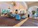 Stylish community center lobby boasts elegant seating, a cozy fireplace, and a well-designed layout at 3609 Citrus Heights Ave, North Las Vegas, NV 89081