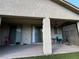 Covered patio space with ceiling fan, table, and easy access to the home's interior at 3609 Citrus Heights Ave, North Las Vegas, NV 89081