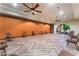 A spacious room features ceiling fans, herringbone floors, and neutral walls at 3609 Citrus Heights Ave, North Las Vegas, NV 89081
