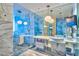 Luxurious bathroom with marble features, modern fixtures, and a large glass-enclosed shower at 4381 W Flamingo Rd # 1019, Las Vegas, NV 89103