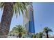 Beautiful view of the Palms Place tower with palm trees and lush landscaping at 4381 W Flamingo Rd # 1019, Las Vegas, NV 89103