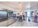 Modern kitchen with stainless steel appliances, hardwood floors, and an open layout at 4381 W Flamingo Rd # 1019, Las Vegas, NV 89103