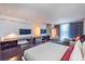 Spacious main bedroom featuring an entertainment center, stylish hardwood flooring, and floor-to-ceiling windows at 4381 W Flamingo Rd # 1019, Las Vegas, NV 89103
