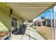 Covered back patio overlooking the spacious backyard with a storage shed at 4431 Bennett Dr, Las Vegas, NV 89121