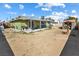 Expansive backyard with a covered patio, storage shed, and potential for landscaping at 4431 Bennett Dr, Las Vegas, NV 89121