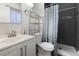 Modern bathroom with stylish vanity, toilet, and walk-in shower with sleek showerhead at 4431 Bennett Dr, Las Vegas, NV 89121