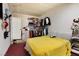 Cozy bedroom features closet shelves and rod, and ample room for relaxation at 4431 Bennett Dr, Las Vegas, NV 89121