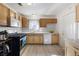 Kitchen with shaker cabinets, modern appliances, and laminate floors at 4431 Bennett Dr, Las Vegas, NV 89121