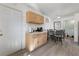 Bright kitchen with light wood cabinets, white countertops, and an adjacent dining area at 4431 Bennett Dr, Las Vegas, NV 89121
