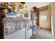 Laundry room space featuring appliances, storage shelves, and basic utilities at 4431 Bennett Dr, Las Vegas, NV 89121