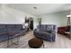 Open concept living room with neutral paint and modern furnishings at 4431 Bennett Dr, Las Vegas, NV 89121