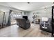 Cozy living room with laminate floors, a slider, and comfortable seating at 4431 Bennett Dr, Las Vegas, NV 89121