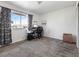 Office setup in a bedroom, complete with a desk, chair, and a printer, perfect for work or study at 4431 Bennett Dr, Las Vegas, NV 89121