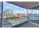 Balcony overlooking Las Vegas strip featuring glass railings and a covered seating area at 4575 Dean Martin Dr # 1811, Las Vegas, NV 89103