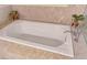Bright bathroom features soaking tub and marble accents at 4575 Dean Martin Dr # 1811, Las Vegas, NV 89103