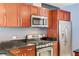 Well-equipped kitchen with cherry wood cabinets, stainless steel appliances, and gas range for gourmet cooking at 4575 Dean Martin Dr # 1811, Las Vegas, NV 89103