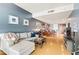 Inviting living room with blue accent wall, open floor plan, and access to a modern kitchen and bar area at 4575 Dean Martin Dr # 1811, Las Vegas, NV 89103