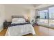Bright main bedroom boasts hardwood floors and stunning city views from the large window at 4575 Dean Martin Dr # 1811, Las Vegas, NV 89103