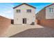 The low maintenance backyard is enclosed with brick wall and features a sliding glass door to the home at 4941 Quest Tribe St, Las Vegas, NV 89122