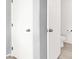 Enclosed toilet in bathroom with white door, chrome handle and toilet paper holder at 4941 Quest Tribe St, Las Vegas, NV 89122