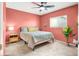 Cozy bedroom featuring soft carpet, ceiling fan and a comfortable queen size bed at 4941 Quest Tribe St, Las Vegas, NV 89122