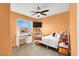 Bright bedroom with a ceiling fan, TV, and a vanity table at 4941 Quest Tribe St, Las Vegas, NV 89122
