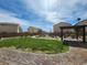 Landscaped community park featuring a covered bench area and sidewalks at 4941 Quest Tribe St, Las Vegas, NV 89122