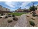 A view of a community park with walking paths and pergola covered benches at 4941 Quest Tribe St, Las Vegas, NV 89122