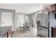 Spacious kitchen and dining area with stainless refrigerator and plenty of storage space at 4941 Quest Tribe St, Las Vegas, NV 89122