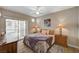 Inviting bedroom with a ceiling fan and sliding doors to a private balcony at 5855 Valley Dr # 2108, North Las Vegas, NV 89031