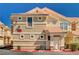 Inviting condo exterior featuring a tile roof, manicured landscaping, and prominent building number at 5855 Valley Dr # 2108, North Las Vegas, NV 89031