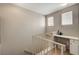 Bright hallway featuring a landing with a built-in desk area and white railing at 5855 Valley Dr # 2108, North Las Vegas, NV 89031