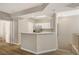 Spacious living area featuring wood floors, breakfast bar, and entrance to the kitchen at 5855 Valley Dr # 2108, North Las Vegas, NV 89031
