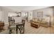 Open-concept living space with a dining area and a view of the kitchen and the stairway landing at 5855 Valley Dr # 2108, North Las Vegas, NV 89031