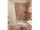 Tiled shower and tub combination create a cozy bathroom at 6412 Big Pine Way, Las Vegas, NV 89108