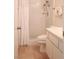 A bright white tiled walk-in shower bathroom is practical and clean at 6412 Big Pine Way, Las Vegas, NV 89108