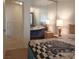 Comfortable bedroom features neutral decor, mirrored closet doors and a cozy ambiance at 6412 Big Pine Way, Las Vegas, NV 89108