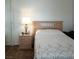 Bright bedroom with a neutral palette, a wooden headboard and a mirrored closet at 6412 Big Pine Way, Las Vegas, NV 89108