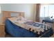 Bedroom featuring large windows, a desk and natural light at 6412 Big Pine Way, Las Vegas, NV 89108