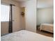 Inviting bedroom with neutral decor and mirrored closet doors near the ensuite at 6412 Big Pine Way, Las Vegas, NV 89108