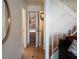 Hallway view of staircase, tile flooring, doorways, and storage space at 6412 Big Pine Way, Las Vegas, NV 89108
