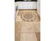 Close-up on the decorative mosaic floor tile in the kitchen at 6412 Big Pine Way, Las Vegas, NV 89108