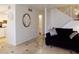 Inviting living room features tile flooring, staircase, and comfortable seating at 6412 Big Pine Way, Las Vegas, NV 89108